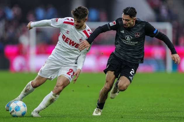 Fußball 2. Bundesliga 16. Spieltag 1. FC Köln - 1. FC Nürnberg am 15.12.2024 im RheinEnergieStadion in Köln Jan Thielmann ( Köln ), links - Berkay Yilmaz ( Nürnberg ), rechts DFL regulations prohibit any use of photographs as image sequences and or quasi-video.