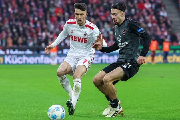 Fußball 2. Bundesliga 16. Spieltag 1. FC Köln - 1. FC Nürnberg am 15.12.2024 im RheinEnergieStadion in Köln Dejan Ljubicic ( Köln ), links - Berkay Yilmaz ( Nürnberg ), rechts DFL regulations prohibit any use of photographs as image sequences and or quasi-video.