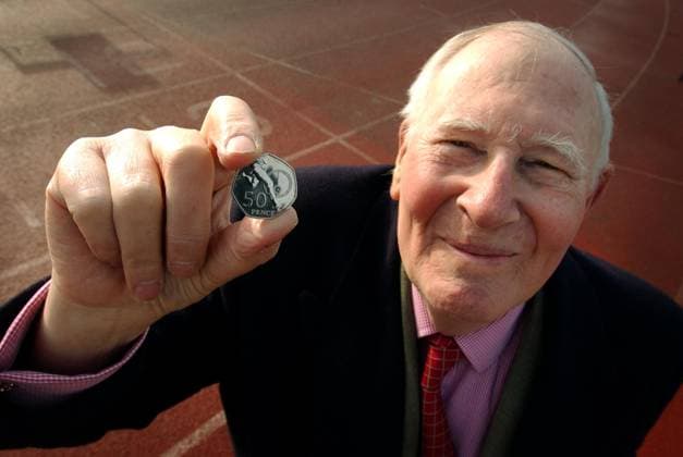 SIR ROGER BANNISTER CBE WITH THE NEW 50P COIN AT THE IFFLEY TRACK WHERE HE RAN A MILE IN 3MINS 59.4SECIN 1954.THE NEW MINT IS TO MARK THE 50TH ANNIVERSARY OF HIS 4 MINUTE MILE. 18 2 04 PILSTON DMGTCHPDPICT000392223682