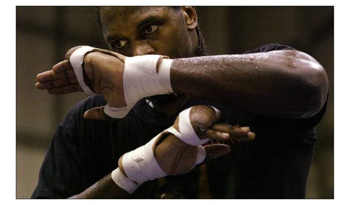 Audley Harrison is to fight Richel Hersisia at Wembley Arena on the 20th March for the He works out at Bridge Park Leisure Centre. pic David Sandison 18 3 2004 DMGTCHPDPICT000404118304