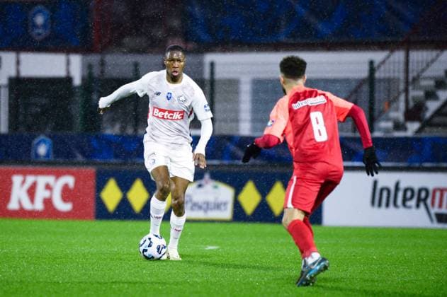 FOOTBALL : Rouen vs Lille - Coupe de France - 20 12 2024 Diakite Bafode ( 4 - Lille ) and Omar Bezzekhami ( 8 - Rouen ) during the French Cup match between FC Rouen and Lille OSC at Stade Robert Diochon on December 20, 2024 in Rouen, France. ( Photo by Dante Badano PsnewZ ) - RouenFrance  Copyright: xDantexBadanox