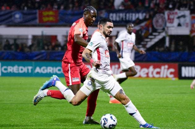 FOOTBALL : Rouen vs Lille - Coupe de France - 20 12 2024 Remy CABELLA ( 10 - Lille ) and DANY GOPROU ( 2 - Rouen ) during the French Cup match between FC Rouen and Lille OSC at Stade Robert Diochon on December 20, 2024 in Rouen, France. ( Photo by Dante Badano PsnewZ ) - RouenFrance  Copyright: xDantexBadanox