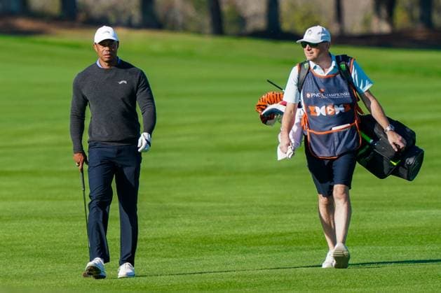December 20, 2024, Orlando, Florida, USA: Tiger Woods (L) and his caddie Lance Bennett approach the 18th green at the PNC Championship Pro-Am at the Ritz-Carlton Golf Club. Orlando USA - ZUMAw109 20241220_fap_w109_010 Copyright: xDebbyxWongx
