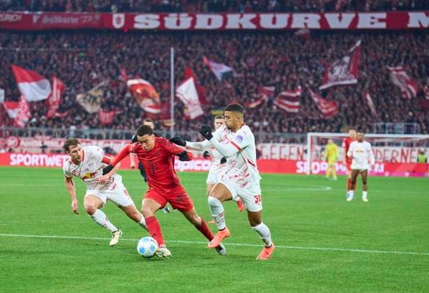 Jamal MUSIALA, FCB 42 compete for the ball, tackling, duel, header, zweikampf, action, fight against Willi ORBAN, RB Leipzig 4 Benjamin HENRICHS, RB Leipzig 39 in the match FC BAYERN MUENCHEN - RB LEIPZIG 5-1 on Dec 20, 2024 in Munich, Germany. Season 2024 2025, 1.Bundesliga, FCB,, München, matchday 15, 15.Spieltag