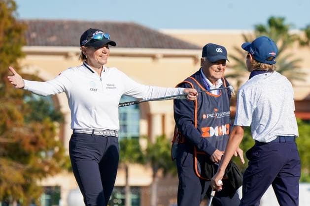 December 21, 2024, Orlando, Florida, USA: (L-R) Annika Sorenstam, Tom Sorenstam (father), and Will McGee (son) on the 18th green after the first round of the PNC Championship at the Ritz-Carlton Golf Club. Orlando USA - ZUMAw109 20241221_fap_w109_003 Copyright: xDebbyxWongx
