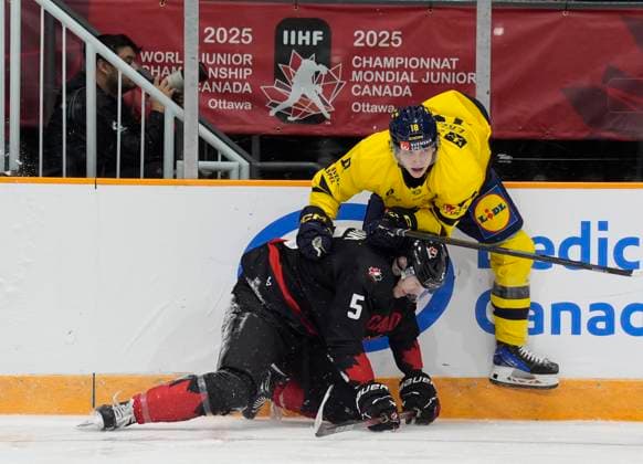 December 21, 2024, Ottawa, On, Canada: Sweden forward Victor Eklund collides with Canada defenceman Oliver Bonk along the boards during first period IIHF World Junior Hockey Championship pre-tournament action, Saturday, Dec. 21, 2024 in Ottawa. Oliver Bonk Victor Eklund  - ZUMAc35_ 20241221_zaf_c35_025 Copyright: xAdrianxWyldx