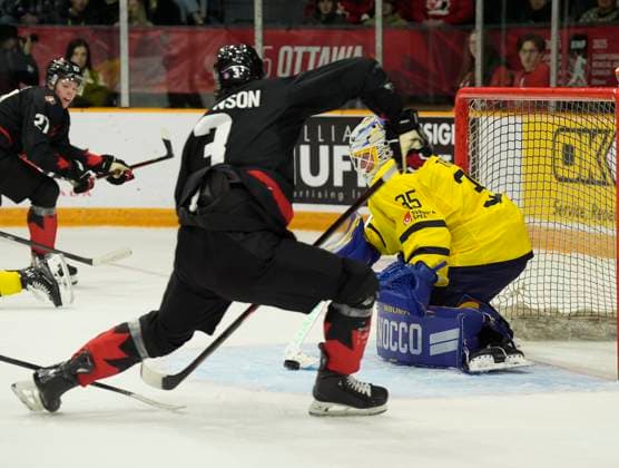 December 21, 2024, Ottawa, On, Canada: Sweden goaltender Melker Thelin gets his stick on the puck under pressure from Canada defenceman Sam Dickinson..during second period IIHF World Junior Hockey Championship pre-tournament action, Saturday, Dec.21, 2024 in Ottawa. Melker Thelin Sam Dickinson  - ZUMAc35_ 20241221_zaf_c35_030 Copyright: xAdrianxWyldx