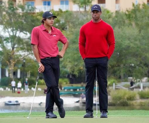 December 22, 2024, Orlando, Florida, USA: Tiger Woods (R) and his son, Charlie Woods, wait on the 18th green during the final round of the PNC Championship at the Ritz-Carlton Golf Club. Orlando USA - ZUMAw109 20241222_fap_w109_005 Copyright: xDebbyxWongx