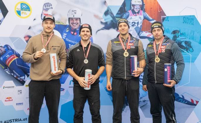 photographer: FIL Michael Kristen 28.12.2024 Austrian Championships, Olympia Ice Track Innsbruck-Igls, Tirol, Austria (AUT), Award Ceremony, Men™s Doubles, picture: Juri Thomas Gatt, Riccardo Martin Schöpf (AUT, 2nd place), Yannick Müller, Armin Frauscher (AUT, 1st place)