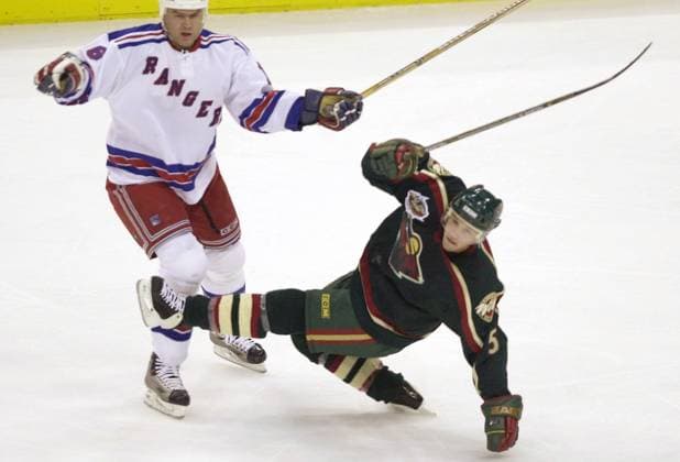KRT SPORTS STORY SLUGGED: RANGERS-WILD KRT PHOTOGRAPH BY SHERRI LAROSE ST. PAUL PIONEER PRESS (October 10) ST. PAUL, MN -- New York Rangers Bobby Holik collides with Minnesota Wild s Brad Bonbardir during first period action of their game at Xcel Energy Center in St. Paul, Minnesota, on Friday, October 10, 2003. (nk) 2003 ST. PAUL MN USA EDITORIAL USE ONLY Copyright: xx KRT SHERRIxLAROSEx krtphotoslive101993
