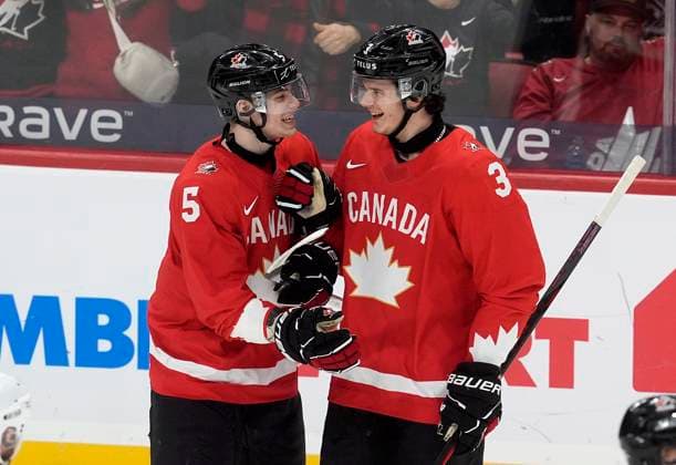 December 29, 2024, Ottawa, On, Canada: Canada defenceman Oliver Bonk (5) celebrates following his goal with teammate Sam Dickinson (3) during first period IIHF World Junior Hockey Championship tournament action against Germany, in Ottawa, Sunday, Dec. 29, 2024. Oliver Bonk Sam Dickinson  - ZUMAc35_ 20241229_zaf_c35_085 Copyright: xAdrianxWyldx