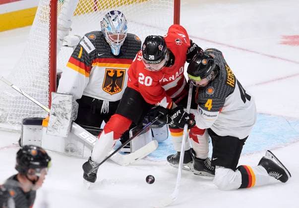 December 29, 2024, Ottawa, On, Canada: Canada forward Ethan Gauthier tries to deflect the puck past Germany goaltender Nico Pertuch as he is pressured by defenceman Max Hense during second period IIHF World Junior Hockey Championship tournament action in Ottawa, Sunday, Dec. 29, 2024. Ethan Gauthier Nico Pertuch Max Hense  - ZUMAc35_ 20241229_zaf_c35_099 Copyright: xAdrianxWyldx