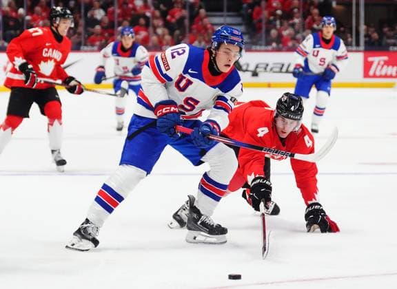 December 31, 2024, Ottawa, On, Canada: Canada s Caden Price (4) pokes the puck away from USA s James Hagens (12) during first period IIHF World Junior Hockey Championship tournament action in Ottawa on Tuesday, Dec. 31, 2024. Canada News - December 31, 2024  - ZUMAc35_ 20241231_zaf_c35_011 Copyright: xSeanxKilpatrickx