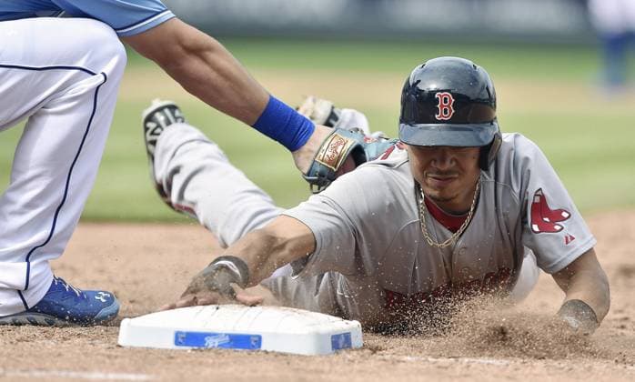 Boston Red Sox vs Kansas City Royals Boston Red Sox s Mookie Betts (50) dives back to first before the pickoff attempt by Kansas City Royals first baseman Eric Hosmer in the seventh inning during Sunday s baseball game on September 14, 2014 at Kauffman Stadium in Kansas City, Mo. (John Sleezer Kansas City Star MCT) KANSAS CITY MO USA EDITORIAL USE ONLY Copyright: xx 1157345 JOHNxSLEEZERx krtphotoslive696219