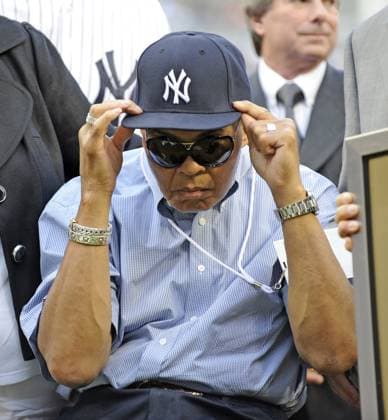 Obituary for Muhammad Ali Muhammad Ali adjusts a New York Yankees cap before a baseball game at Yankee Stadium in New York on August 6, 2009. Ali died on Friday, June 3, 2016, at 74. (David Pokress Newsday TNS) New York NY USA EDITORIAL USE ONLY Copyright: xx 1185712 DavidxPokressx krtphotoslive754853