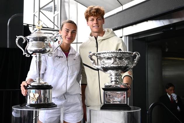 TENNIS AUSTRALIAN OPEN DRAW, Aryna Sabalenka of Belarus (left) poses for a photo with the Daphne Akhurst Memorial Cup and Jannik Sinner of Italy (right) poses for photographs with the Norman Brookes Challenge Cup pose for a photo during the draw for the 2025 Australian Open tennis tournament, at Melbourne Park, Melbourne, Thursday, January 09, 2025. ( NO ARCHIVING, EDITORIAL USE ONLY, NO USE IN BOOKS WITHOUT CONSENT Melbourne Victoria Australia  Copyright: xJOELxCARRETTx 20250109144087683403