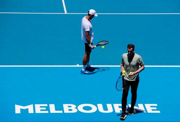 (250111) -- MELBOURNE, Jan. 11, 2025 -- Novak Djokovic (L) of Serbia and his coach Andy Murray attend a training session during the Australian Open tennis tournament in Melbourne, Australia, Jan. 11, 2025. ) (SP)AUSTRALIA-MELBOURNE-TENNIS-AUSTRALIAN OPEN-TRAINING MaxPing 
