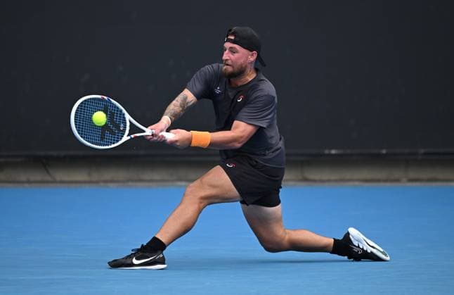 TENNIS AUSTRALIAN OPEN, Omar Jasika of Australia returns during his round 1 match against Hugo Gaston of France during the 2025 Australian Open at Melbourne Park in Melbourne, Sunday, January 12, 2025. ( NO ARCHIVING, EDITORIAL USE ONLY, NO USE IN BOOKS WITHOUT CONSENT MELBOURNE VICTORIA AUSTRALIA  Copyright: xJAMESxROSSx 20250112137155326384