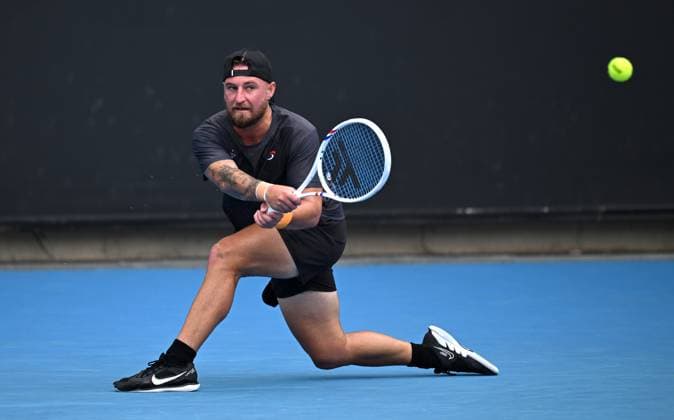 TENNIS AUSTRALIAN OPEN, Omar Jasika of Australia returns during his round 1 match against Hugo Gaston of France during the 2025 Australian Open at Melbourne Park in Melbourne, Sunday, January 12, 2025. ( NO ARCHIVING, EDITORIAL USE ONLY, NO USE IN BOOKS WITHOUT CONSENT MELBOURNE VICTORIA AUSTRALIA  Copyright: xJAMESxROSSx 20250112181514710249