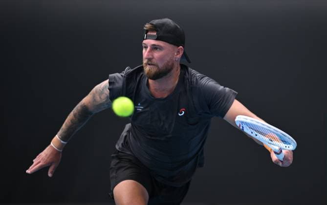 TENNIS AUSTRALIAN OPEN, Omar Jasika of Australia returns during his round 1 match against Hugo Gaston of France during the 2025 Australian Open at Melbourne Park in Melbourne, Sunday, January 12, 2025. ( NO ARCHIVING, EDITORIAL USE ONLY, NO USE IN BOOKS WITHOUT CONSENT MELBOURNE VICTORIA AUSTRALIA  Copyright: xJAMESxROSSx 20250112184248349175