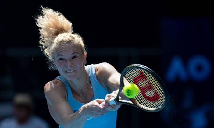 (250113) -- MELBOURNE, Jan. 13, 2025 -- Katerina Siniakova hits a return during the women s singles first round match between Iga Swiatek of Poland and Katerina Siniakova of the Czech Republic at Australian Open tennis tournament in Melbourne, Australia, Jan. 13, 2025. (Photo by Xinhua) (SP)AUSTRALIA-MELBOURNE-TENNIS-AUSTRALIAN OPEN-DAY 2 HuxJingchen 