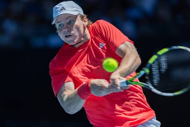 (250113) -- MELBOURNE, Jan. 13, 2025 -- Alex Michelsen hits a return during the men s singles first round match between Stefanos Tsitsipas of Greece and Alex Michelsen of the United States at Australian Open tennis tournament in Melbourne, Australia, Jan. 13, 2025. (Photo by Xinhua) (SP)AUSTRALIA-MELBOURNE-TENNIS-AUSTRALIAN OPEN-DAY 2 HuxJingchen 
