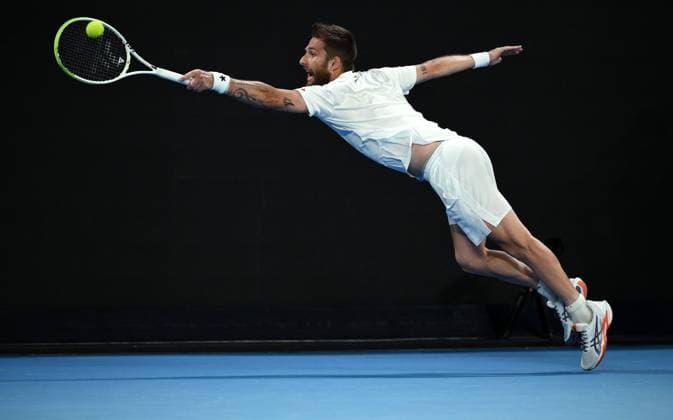 Sport Bilder des Tages TENNIS AUSTRALIAN OPEN, Corentin Moutet of France in action during his round 1 match against Alexei Popyrin of Australia during the 2025 Australian Open at Melbourne Park in Melbourne, Tuesday, January 14, 2025. ( NO ARCHIVING, EDITORIAL USE ONLY, NO USE IN BOOKS WITHOUT CONSENT MELBOURNE VICTORIA AUSTRALIA  Copyright: xJOELxCARRETTx 20250114198565165170