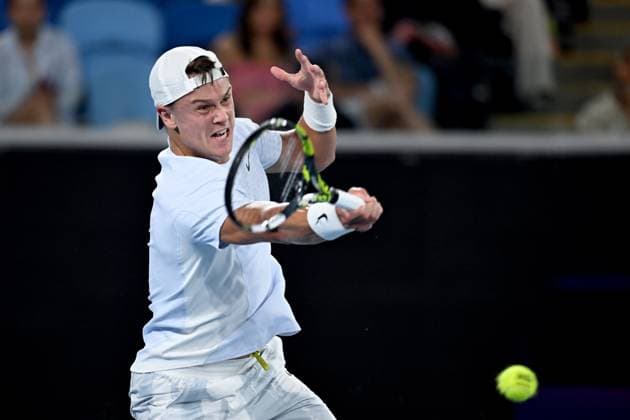 TENNIS AUSTRALIAN OPEN, Holger Rune of Denmark returns during his round three match against Miomir Kecmanovic of Serbia during the 2025 Australian Open at Melbourne Park in Melbourne, Saturday, January 18, 2025. ( NO ARCHIVING, EDITORIAL USE ONLY, NO USE IN BOOKS WITHOUT CONSENT MELBOURNE VICTORIA AUSTRALIA  Copyright: xJAMESxROSSx 20250118129286000399