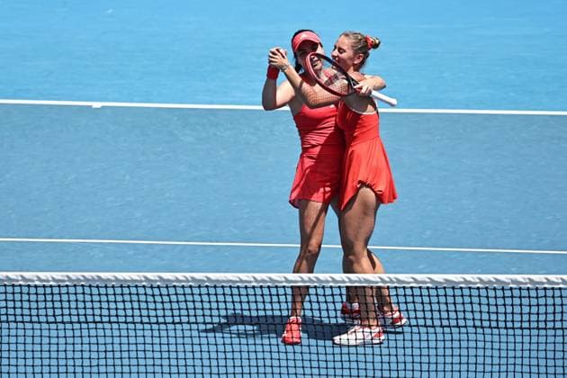 Marta Kostyuk (blonde hair), UKR, and Elena-Gabriela Ruse (red cap), ROU, during womenÂ s doubles at 2025 Australian Open in Melbourne, 19 01 2025; -