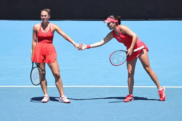Marta Kostyuk (blonde hair), UKR, and Elena-Gabriela Ruse (red cap), ROU, during womenÂ s doubles at 2025 Australian Open in Melbourne, 19 01 2025; -
