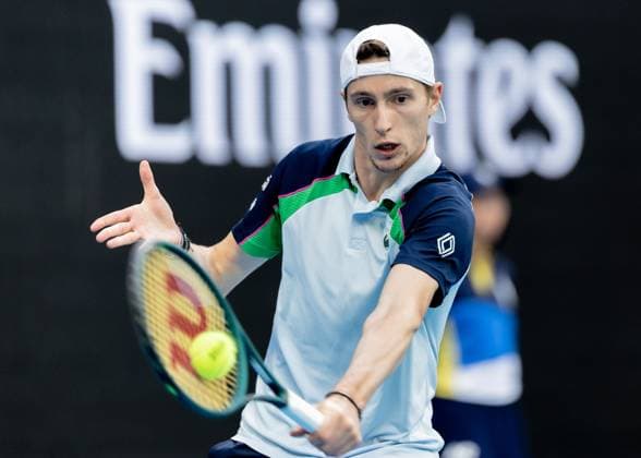 (250119) -- MELBOURNE, Jan. 19, 2025 -- Ugo Humbert hits a return during the men s singles 4th round match between Alexander Zverev of Germany and Ugo Humbert of France at Australian Open tennis tournament in Melbourne, Australia, Jan. 19, 2025. (Photo by Xinhua) (SP)AUSTRALIA-MELBOURNE-TENNIS-AUSTRALIAN OPEN-DAY 8 HuxJingchen 