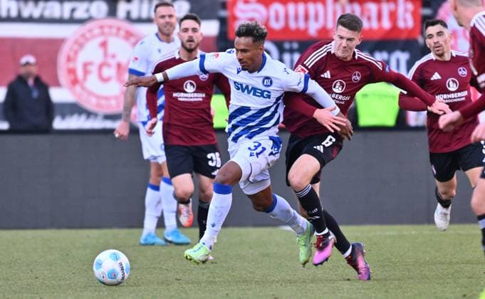 Sport Bilder des Tages 19.01.2025 - Fussball - Saison 2024 2025 - 2. Fussball - Bundesliga - 18. Spieltag: 1. FC Nürnberg FCN ( Club ) - Karlsruher SC KSC - Sportfoto Zink - xwoxzix - DFL regulations prohibit any use of photographs as image sequences and or quasi-video - only for editorial use - Bambase Conte (31, Karlsruher SC KSC ) Florian Flick (6, 1. FC Nürnberg FCN )