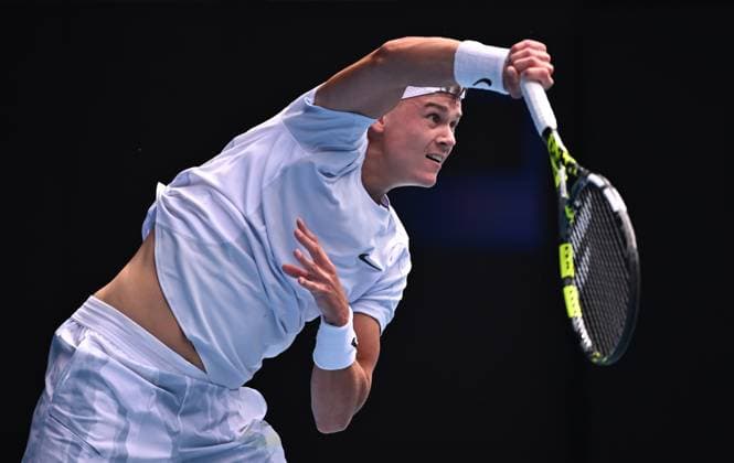 TENNIS AUSTRALIAN OPEN, Holger Rune of Denmark serves during his round 4 match against Jannik Sinner of Italy during the 2025 Australian Open at Melbourne Park in Melbourne, Monday, January 20, 2025. ( NO ARCHIVING, EDITORIAL USE ONLY, NO USE IN BOOKS WITHOUT CONSENT MELBOURNE VICTORIA AUSTRALIA  Copyright: xJAMESxROSSx 20250120159391312926