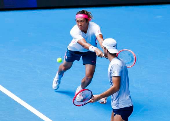 (250120) -- MELBOURNE, Jan. 20, 2025 -- Zhang Zhizhen (L) Tomas Machac compete during the men s doubles third round match between Zhang Zhizhen (China) Tomas Machac (the Czech Republic) and Hugo Nys (Monaco) Edouard Roger-Vasselin (France) at Australian Open tennis tournament in Melbourne, Australia, Jan. 20, 2025. (Photo by Xinhua) (SP)AUSTRALIA-MELBOURNE-TENNIS-AUSTRALIAN OPEN-DAY 9 ChuxChen 