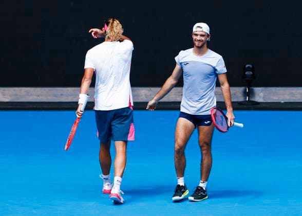 (250120) -- MELBOURNE, Jan. 20, 2025 -- Zhang Zhizhen (L) Tomas Machac celebrate scoring during the men s doubles third round match between Zhang Zhizhen (China) Tomas Machac (the Czech Republic) and Hugo Nys (Monaco) Edouard Roger-Vasselin (France) at Australian Open tennis tournament in Melbourne, Australia, Jan. 20, 2025. (Photo by Xinhua) (SP)AUSTRALIA-MELBOURNE-TENNIS-AUSTRALIAN OPEN-DAY 9 ChuxChen 