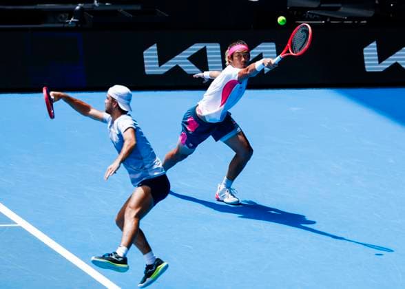 (250120) -- MELBOURNE, Jan. 20, 2025 -- Zhang Zhizhen (R) Tomas Machac compete during the men s doubles third round match between Zhang Zhizhen (China) Tomas Machac (the Czech Republic) and Hugo Nys (Monaco) Edouard Roger-Vasselin (France) at Australian Open tennis tournament in Melbourne, Australia, Jan. 20, 2025. (Photo by Xinhua) (SP)AUSTRALIA-MELBOURNE-TENNIS-AUSTRALIAN OPEN-DAY 9 ChuxChen 