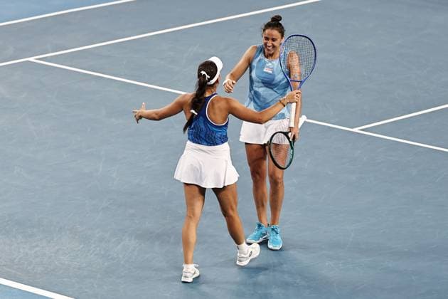 Kamilla Rakhimova (white cap), RUS, and Sara Sorribes Tormo (no cap), ESP, during womenÂ s doubles at 2025 Australian Open in Melbourne, 20 01 2025; -