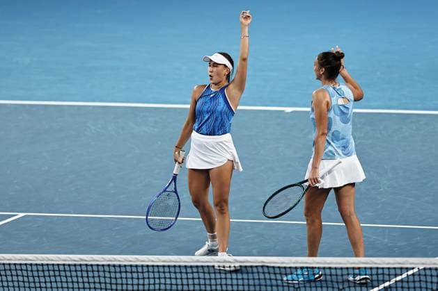Kamilla Rakhimova (white cap), RUS, and Sara Sorribes Tormo (no cap), ESP, during womenÂ s doubles at 2025 Australian Open in Melbourne, 20 01 2025; -
