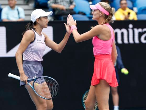 (250122) -- MELBOURNE, Jan. 22, 2025 -- Zhang Shuai(L) Kristina Mladenovic clap hands during the women s doubles quarterfinal match between Zhang Shuai of China Kristina Mladenovic of France and Taylor Townsend of the United States Katerina Siniakova of the Czech Republic at Australian Open tennis tournament in Melbourne, Australia, Jan. 22, 2025. ) (SP)AUSTRALIA-MELBOURNE-TENNIS-AUSTRALIAN OPEN-DAY 11 MaxPing 