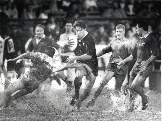 Cathay Pacific Hongkong Bank Invitation Sevens in Hong Kong Stadium: New Zealand s Dallas Seymour powers his way through the mud during the defeat of Hong Kong. All Blacks win 54-0. 04APR92 Hong Kong Hong Kong EDITORIAL USE ONLY  Copyright: xx MER1502142059098530 JohnxLehmannx 0795501269st