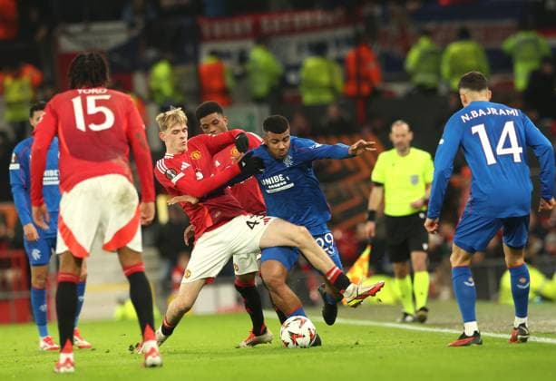 Toby Collyer of Manchester United, ManU battles for the ball with Hamza Igamane of Rangers during the Europa League group phase match at Old Trafford, Manchester. Manchester United v Rangers, UEFA Europa League, Group Stage, Football, Old Trafford, Manchester, UK - 23 Jan 2025 EDITORIAL USE ONLY No use with unauthorised audio, video, data, fixture lists, club league logos or live services. Online in-match use limited to 120 images, no video emulation. No use in betting, games or single club league player publications. Copyright: xRangersxFC Shutterstockx 15111693gg