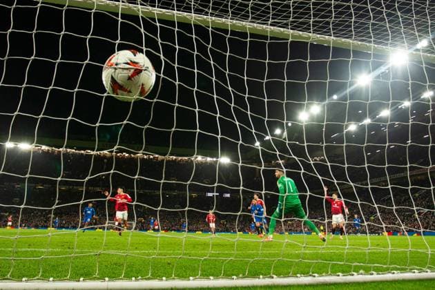 Cyriel Dessers of Rangers scores past Manchester United, ManU goalkeeper Altay Bayindir during the Europa League group phase match at Old Trafford, Manchester. Manchester United v Rangers, UEFA Europa League, Group Stage, Football, Old Trafford, Manchester, UK - 23 Jan 2025 EDITORIAL USE ONLY No use with unauthorised audio, video, data, fixture lists, club league logos or live services. Online in-match use limited to 120 images, no video emulation. No use in betting, games or single club league player publications.  Copyright: xRangersxFC Shutterstockx 15111693lu