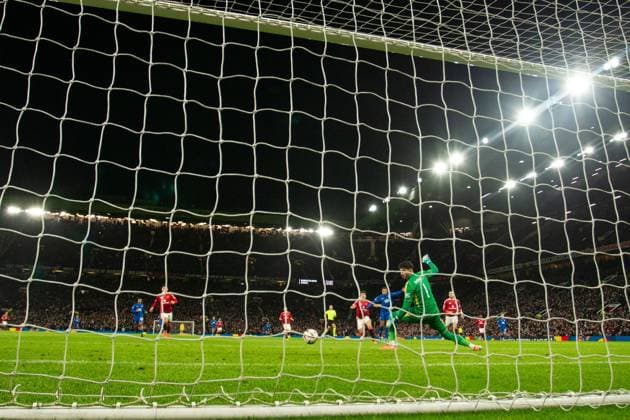 Cyriel Dessers of Rangers scores past Manchester United, ManU goalkeeper Altay Bayindir during the Europa League group phase match at Old Trafford, Manchester. Manchester United v Rangers, UEFA Europa League, Group Stage, Football, Old Trafford, Manchester, UK - 23 Jan 2025 EDITORIAL USE ONLY No use with unauthorised audio, video, data, fixture lists, club league logos or live services. Online in-match use limited to 120 images, no video emulation. No use in betting, games or single club league player publications.  Copyright: xRangersxFC Shutterstockx 15111693ls