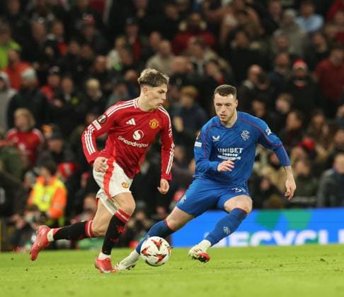 Alejandro Garnacho of Manchester United, ManU and Leon King of Rangers during the Europa League group phase match at Old Trafford, Manchester. Manchester United v Rangers, UEFA Europa League, Group Stage, Football, Old Trafford, Manchester, UK - 23 Jan 2025 EDITORIAL USE ONLY No use with unauthorised audio, video, data, fixture lists, club league logos or live services. Online in-match use limited to 120 images, no video emulation. No use in betting, games or single club league player publications.  Copyright: xRangersxFC Shutterstockx 15111693my