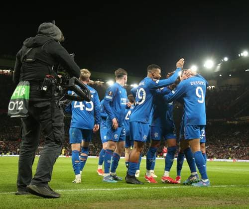 Cyriel Dessers of Rangers celebrates his goal with his team mates during the Europa League group phase match at Old Trafford, Manchester. Manchester United, ManU v Rangers, UEFA Europa League, Group Stage, Football, Old Trafford, Manchester, UK - 23 Jan 2025 EDITORIAL USE ONLY No use with unauthorised audio, video, data, fixture lists, club league logos or live services. Online in-match use limited to 120 images, no video emulation. No use in betting, games or single club league player publications.  Copyright: xRangersxFC Shutterstockx 15111693mw