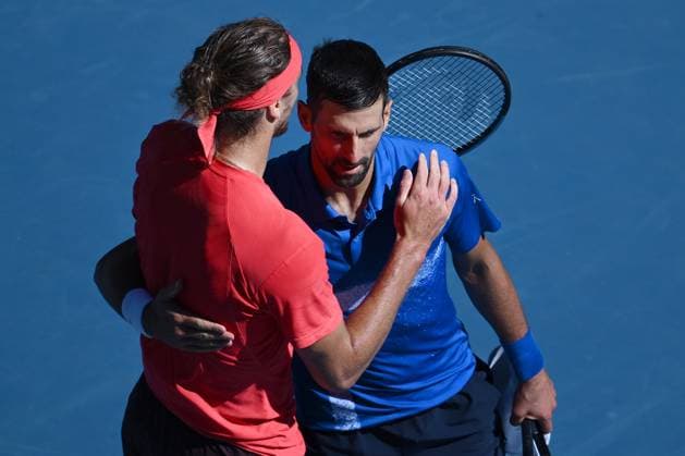 TENNIS AUSTRALIAN OPEN, Novak Djokovic of Serbia (right) embraces Alexander Zverev of Germany after retiring and loosing the first set, during his semi-final match during the 2025 Australian Open at Melbourne Park in Melbourne, Friday, January 24, 2025. ( NO ARCHIVING, EDITORIAL USE ONLY, NO USE IN BOOKS WITHOUT CONSENT MELBOURNE VICTORIA AUSTRALIA  Copyright: xJOELxCARRETTx 20250124181509074069