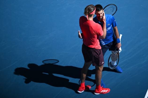 TENNIS AUSTRALIAN OPEN, Novak Djokovic of Serbia (right) embraces Alexander Zverev of Germany after retiring and loosing the first set, during his semi-final match during the 2025 Australian Open at Melbourne Park in Melbourne, Friday, January 24, 2025. ( NO ARCHIVING, EDITORIAL USE ONLY, NO USE IN BOOKS WITHOUT CONSENT MELBOURNE VICTORIA AUSTRALIA  Copyright: xJOELxCARRETTx 20250124126487171004