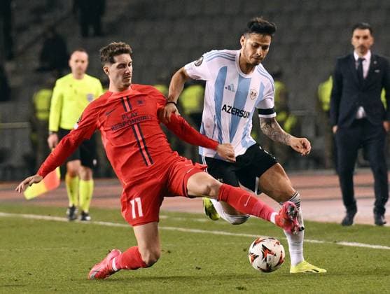 (250124) -- BAKU, Jan. 24, 2025 -- David Miculescu (L) of FCSB vies with Matheus Silva of Qarabag during a UEFA Europa League match between Qarabag and FCSB in Baku, Azerbaijan, Jan. 23, 2025. (Photo by v Xinhua) (SP)AZERBAIJAN-BAKU-FOOTBALL-UEFA EUROPA LEAGUE-QARABAG VS FCSB TofikxBabaye 