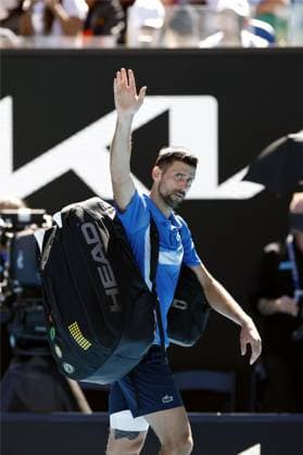Tennis: Australian Open Novak Djokovic of Serbia leaves the court after retiring from an Australian Open tennis tournament midway through a men s singles semifinal match against Alexander Zverev of Germany due to an injury in Melbourne on Jan. 24, 2025.  A14AA0004034025P