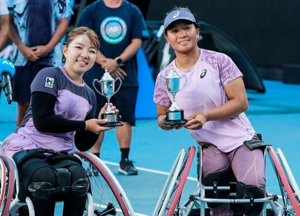 (250124) -- MELBOURNE, Jan. 24, 2025 -- Zhu Zhenzhen (R) Tanaka Manami pose with the trophies after the women s wheelchair doubles final between Wang Ziying Li Xiaohui of China and Zhu Zhenzhen (China) Tanaka Manami (Japan) at Australian Open tennis tournament in Melbourne, Australia, Jan. 24, 2025. ) (SP)AUSTRALIA-MELBOURNE-TENNIS-AUSTRALIAN OPEN-WOMEN S WHEELCHAIR DOUBLES-FINAL MaxPing 